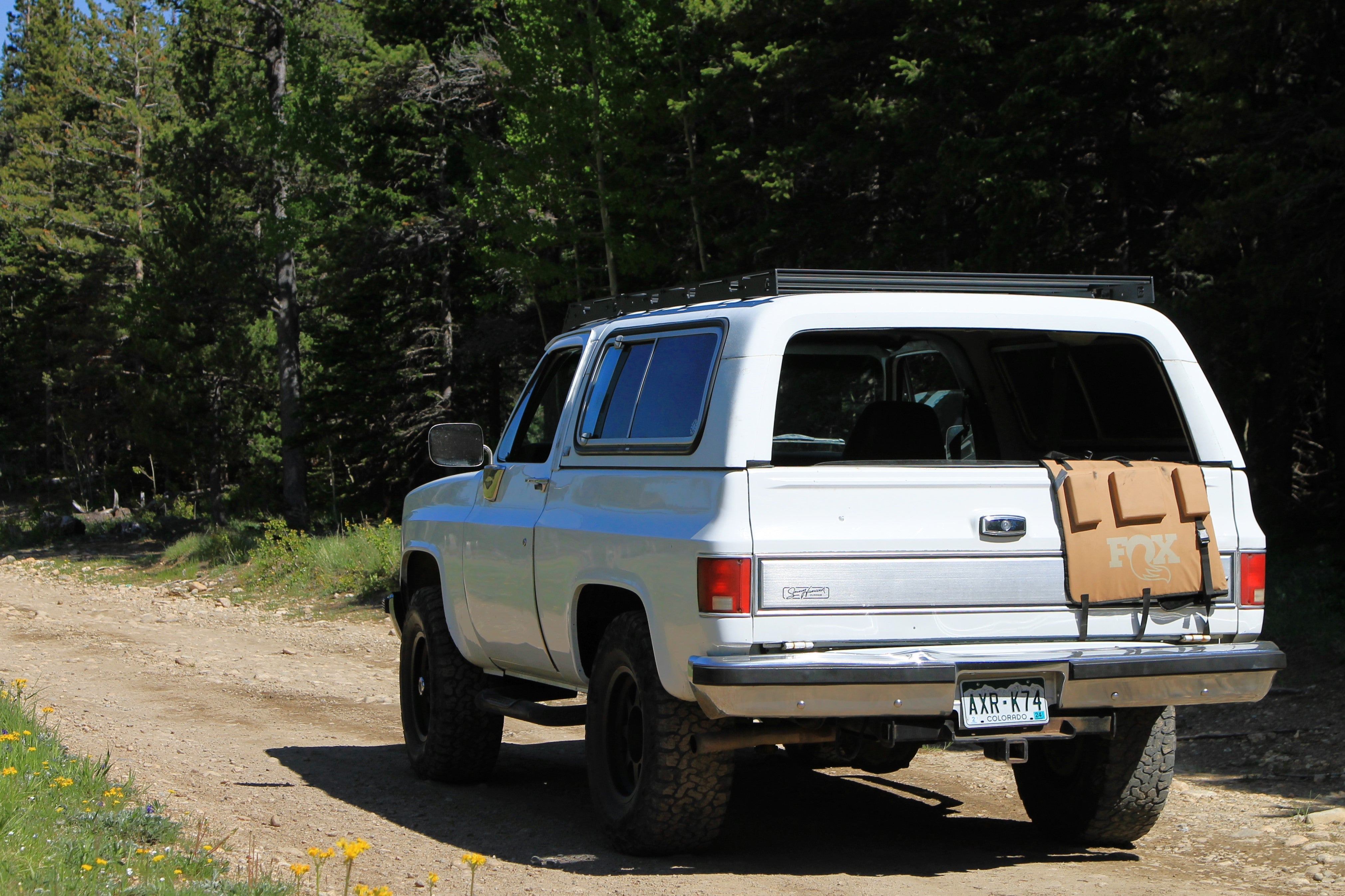 White Square Body Blazer with Baseline Overland Roof Rack Fox Tailgate Pad